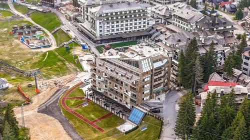 an overhead view of a large building in a city at Grey Hotel Kopaonik in Kopaonik