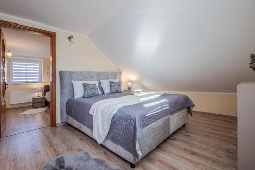 a bedroom with a large bed in a room at Leonardo Vila Centre in Palanga