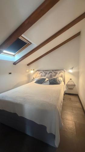a bedroom with a large white bed in a room at Sepic Apartments in Opatija
