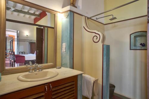 a bathroom with a sink and a mirror at Dune de L'orient in Pondicherry