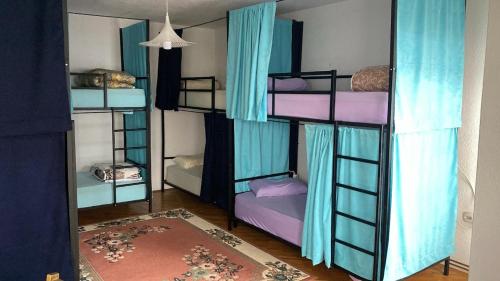 a group of bunk beds in a room at Kardelen Hostel in Prishtinë