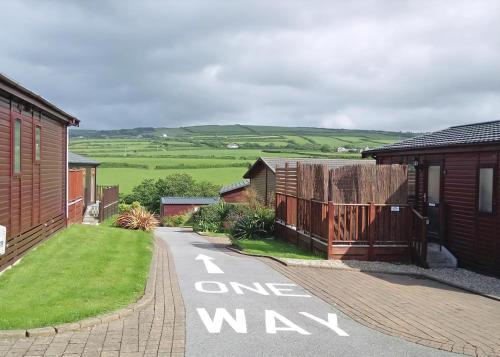 a street with a one way sign on the road at Bossiney Bay in Tintagel