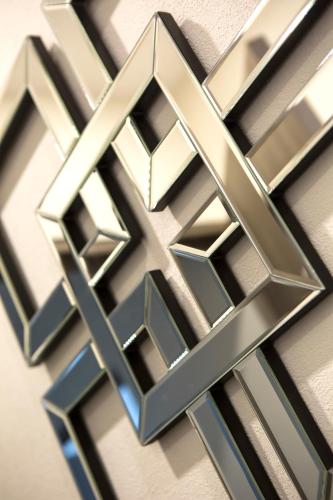 a close up of a metal wall decoration at Suites Rio Elba in Mexico City
