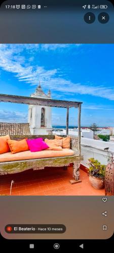 a couch sitting on top of a roof at El Beaterio Apartments in Tarifa