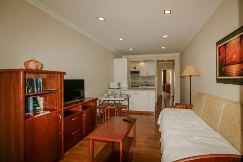 a living room with a couch and a table at FLH Monte Gordo Balcony Flat in Monte Gordo