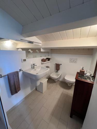 a bathroom with a sink and a toilet at I tre platani in Marina di Massa