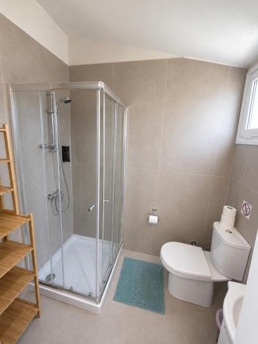 a bathroom with a shower and a toilet and a sink at Smart Deluxe Studio N9 private Kitchenette Balcony Beach 250m Marina Port 900m in Limassol