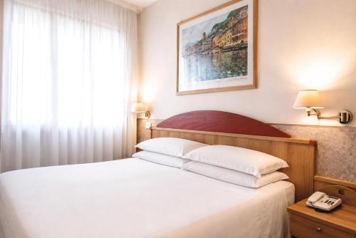 เตียงในห้องที่ Phi Hotel Ambra