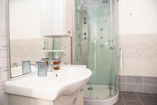 a bathroom with a sink and a shower at Bed And Breakfast Nonna Pia in Fertilia
