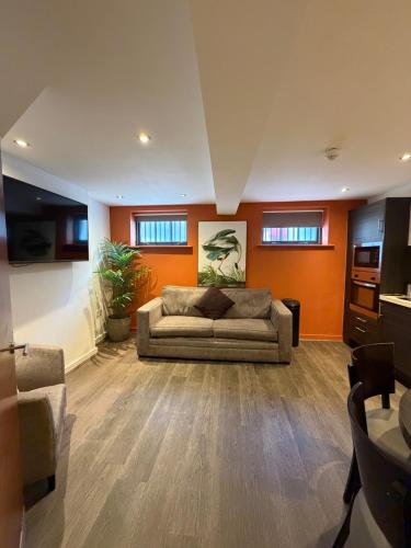 a large living room with a couch in the middle at EPIC Apart Hotel, Duke Street, Central Liverpool Apartments Near Liverpool ONE in Liverpool
