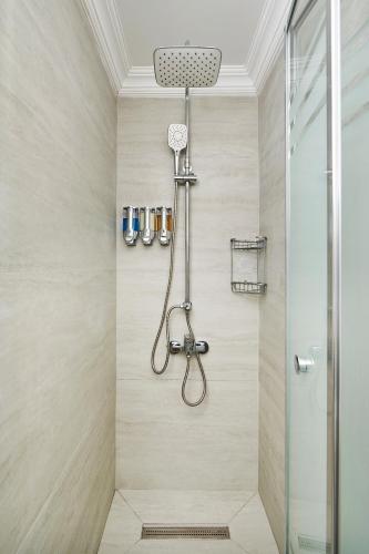 a shower with a shower head in a bathroom at Fun Sun Smart Akman Beach in Kemer