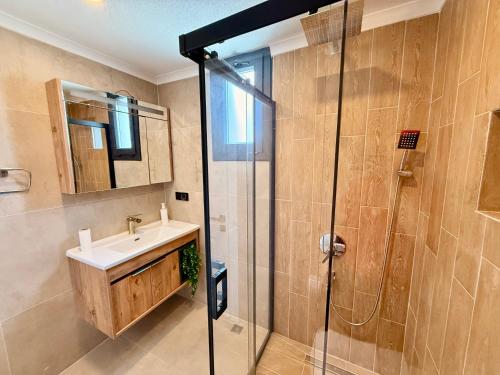 a bathroom with a sink and a shower at As Villas Villa Asil in Fethiye