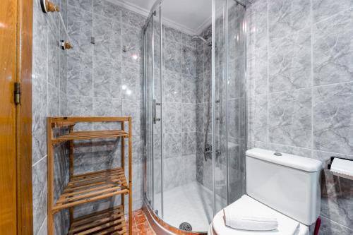 a bathroom with a shower and a toilet at Sunrise Arts 1 in Torrevieja