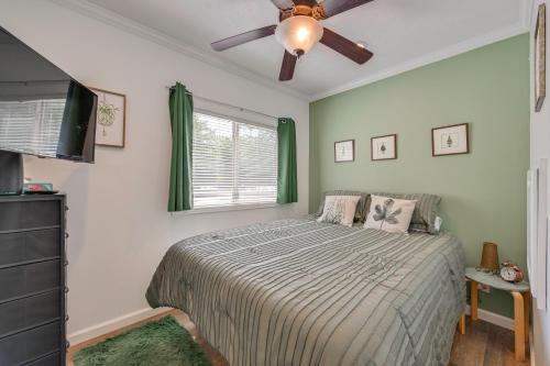 a bedroom with a bed and a ceiling fan at Pool & Lake Access! Sherrills Ford Tiny Home in Sherrills Ford