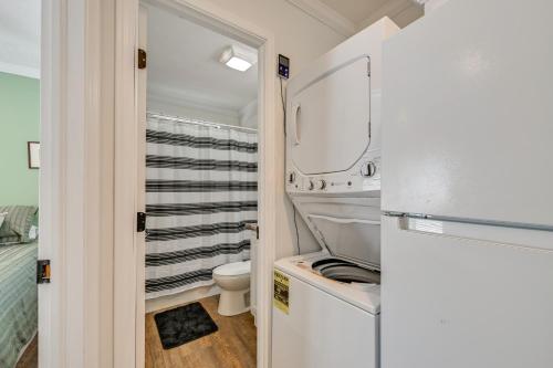 a small bathroom with a toilet and a mirror at Pool & Lake Access! Sherrills Ford Tiny Home in Sherrills Ford