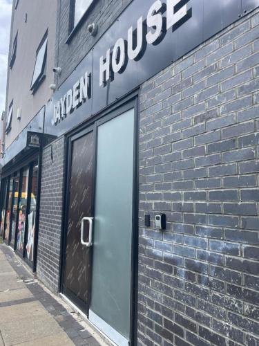 a store front of a brick building with a door at Jayden house in Middlesbrough