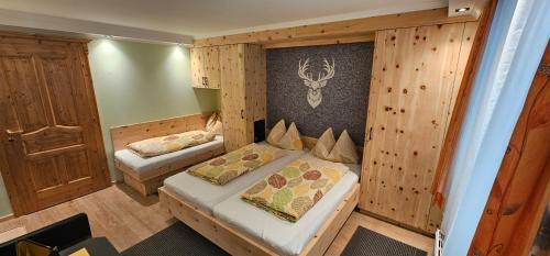 a small room with a bed and a small bedroom at Gasthof Gosausee in Gosau