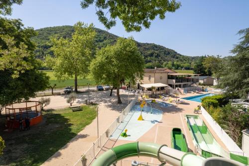 an overhead view of a playground with a pool at Camping Le Chassezac in Sampzon