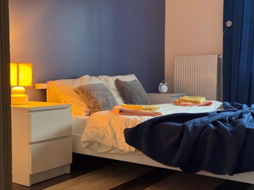 a bedroom with a bed with two towels on it at Bukuljska svežina 1 in Arandelovac