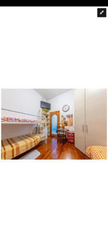 a room with bunk beds and a dining room at Casa Revello in Milan