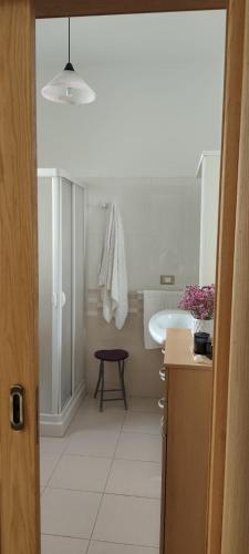 a bathroom with a sink and a toilet and a mirror at Passo lento in Leverano