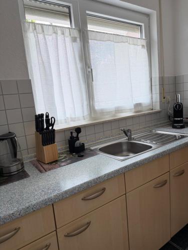 a kitchen counter with a sink and a window at Gemütliche Ferienwohnung in Sigmaringen in Sigmaringen