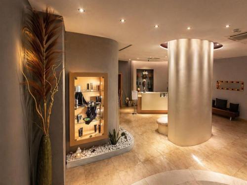 a lobby with a large column in a room at Best Western Hotel Palace Lucera in Lucera