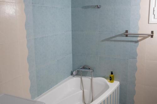 a bath tub in a bathroom with a shower at Maria Apartments in Perea