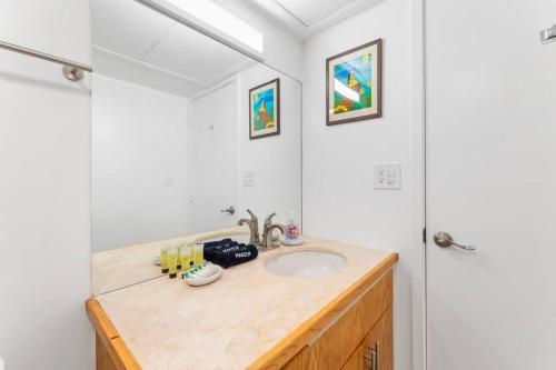 a bathroom with a sink and a shower at Executive Center 1604 in Honolulu