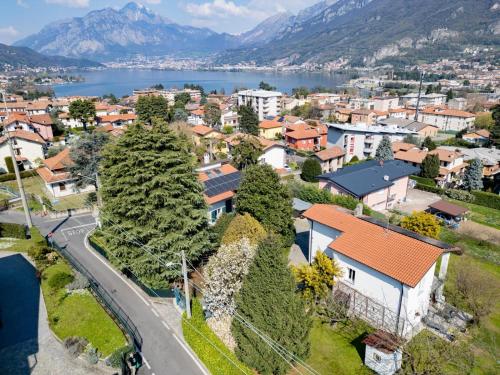 an aerial view of a town with a lake and mountains at La Casetta di Renzo e Lucia in Olginate
