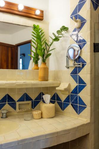 a bathroom with a sink and a mirror at Hotel Santa Fe in Puerto Escondido