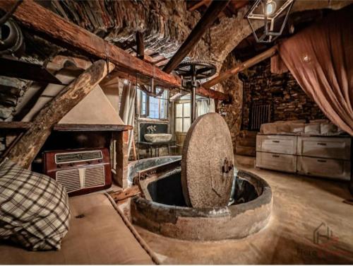 a kitchen with a large tub in the middle of a room at Soqquadro Art&Relax Alassio - Romantico Frantoio 1600 in Alassio
