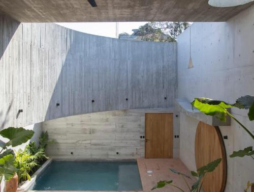 a swimming pool in a building with a wooden wall at Design-Forward 2BR Villa with Private Pool NEW in Brisas de Zicatela