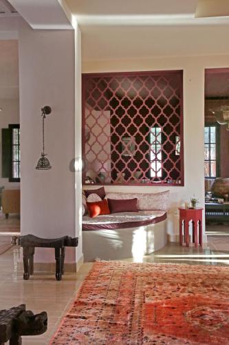 a living room with a couch and a rug at Villa Samadhi - Luxury & Serenity in Marrakesh