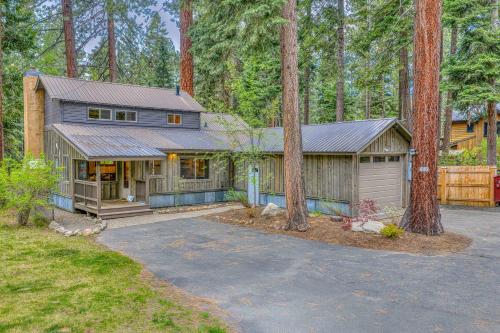 a house in the woods with a garage at 3BD with Hot Tub Two Minutes from King Beach in Tahoe Vista