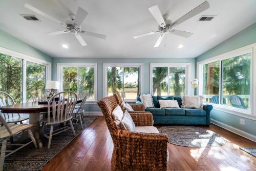 a living room with a couch and a table at 546 Tarpon Pond Cottage in Seabrook Island