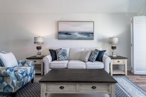 a living room with a couch and a coffee table at 1306 Pelican Watch Villa in Seabrook Island