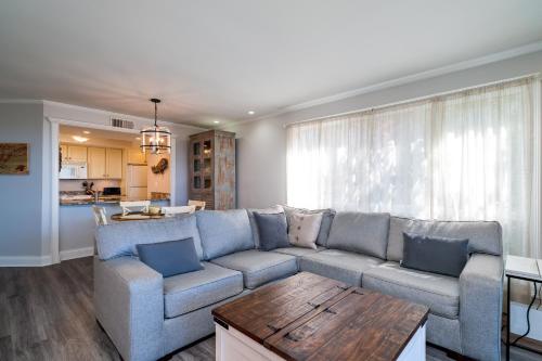a living room with a couch and a table at 1385 Pelican Watch Villa in Seabrook Island