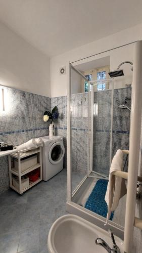 a bathroom with a shower and a sink at Sea suite positano in Positano