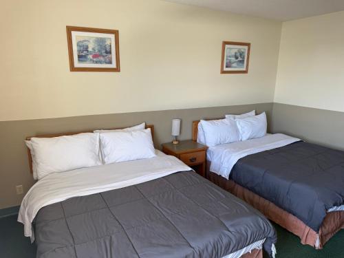 a hotel room with two beds in a room at Wheatland Hotel in Strathmore