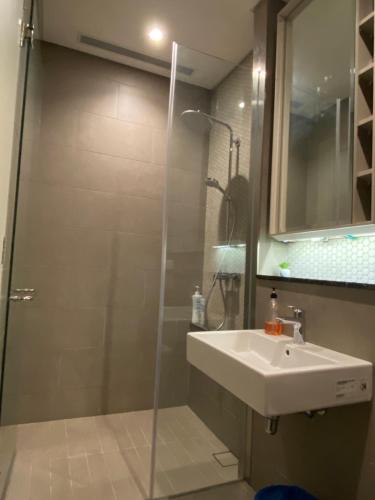 a bathroom with a shower and a sink at Luxury Suites By Lucentia Residence BBCC Kuala Lumpur in Kuala Lumpur