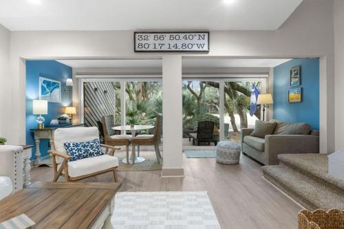 a living room with a couch and a table at 620 Shadowwood in Seabrook Island