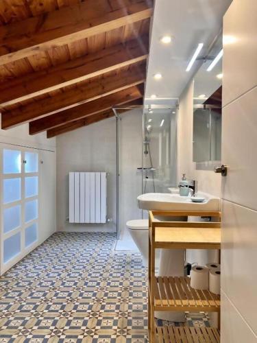 a bathroom with a sink and a toilet at Kantauri Homes- KAI in Bermeo