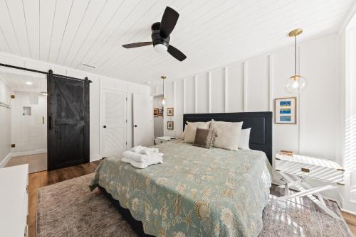a bedroom with a bed and a ceiling fan at 1338 Pelican Watch Villa in Seabrook Island