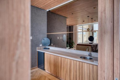 a kitchen with a counter with a sink in it at Nido x Downtown MTY in Monterrey