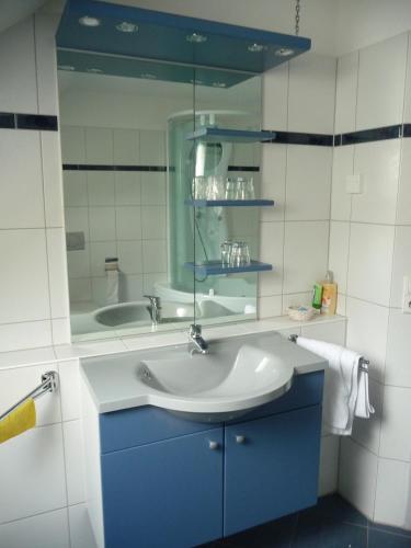 a bathroom with a sink and a mirror at Haus Dachsberg Todtmoos in Todtmoos