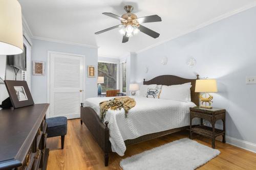 a bedroom with a bed and a ceiling fan at 1327 Pelican Watch Villa in Seabrook Island