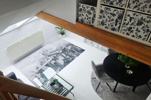 an overhead view of a living room with a table and chairs at Apartmán u pilotky in Poděbrady