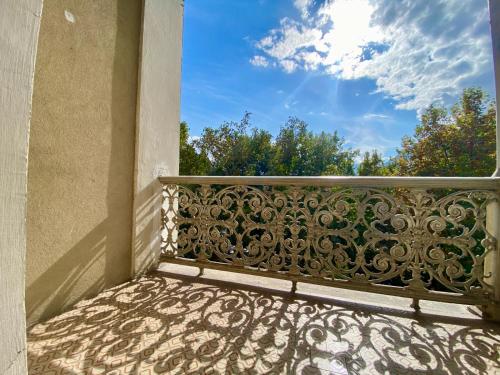 a balcony with a metal railing on a building at Spazioso e accogliente nel centro di Merano in Merano