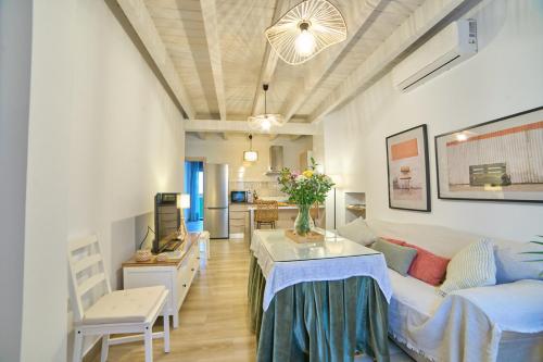 a living room with a couch and a table at Apartamentos La Gruta de Aracena 3 in Aracena
